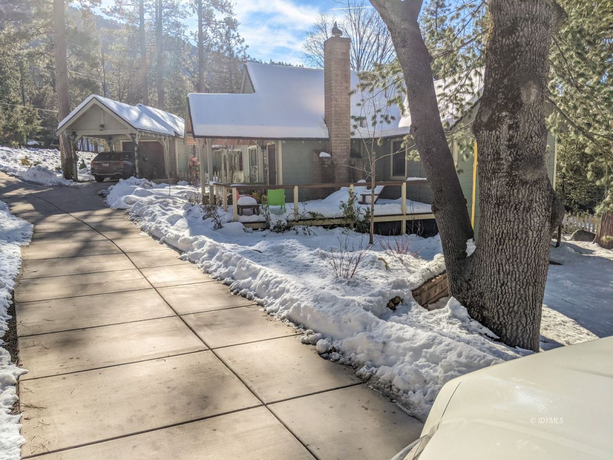 25505 Seneca Road Idyllwild, CA 92549 - Photo 39 of 60 a view of a house with backyard porch and sitting area