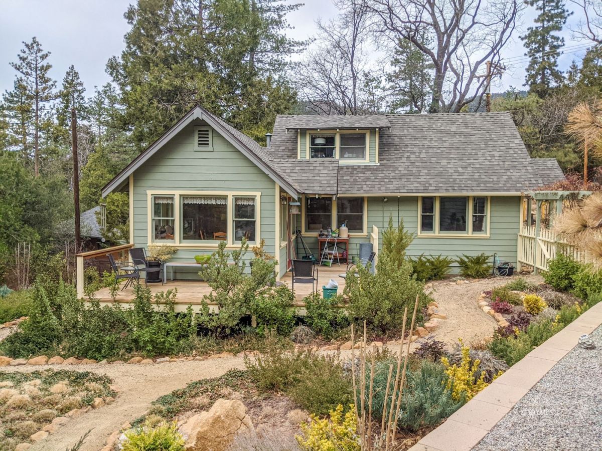 25505 Seneca Road Idyllwild, CA 92549 - Photo 41 of 60 a front view of a house with a yard and potted plants