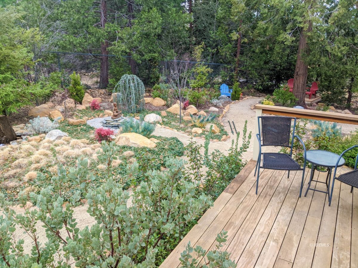 25505 Seneca Road Idyllwild, CA 92549 - Photo 7 of 60 a view of balcony with wooden floor and outdoor seating