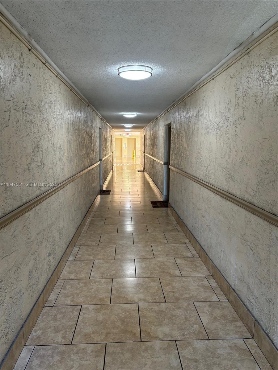 4200 Inverrary Boulevard, Unit 3604 Lauderhill, FL 33319 - Photo 13 of 14 a view of a hallway