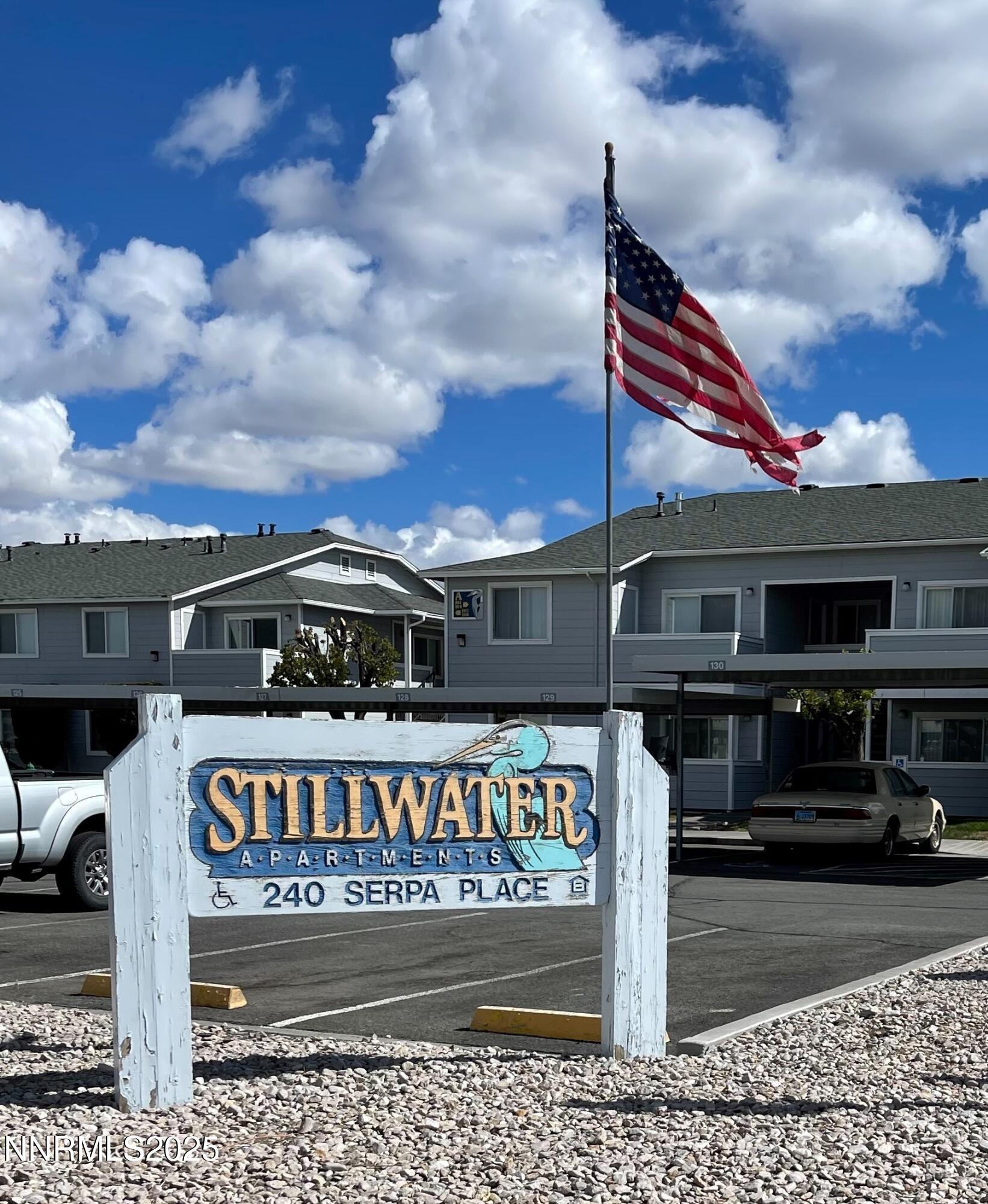 a view of street sign on a sidewalk