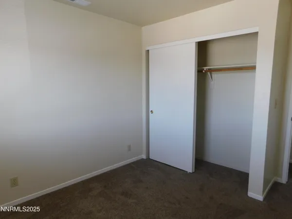 an empty room with closet