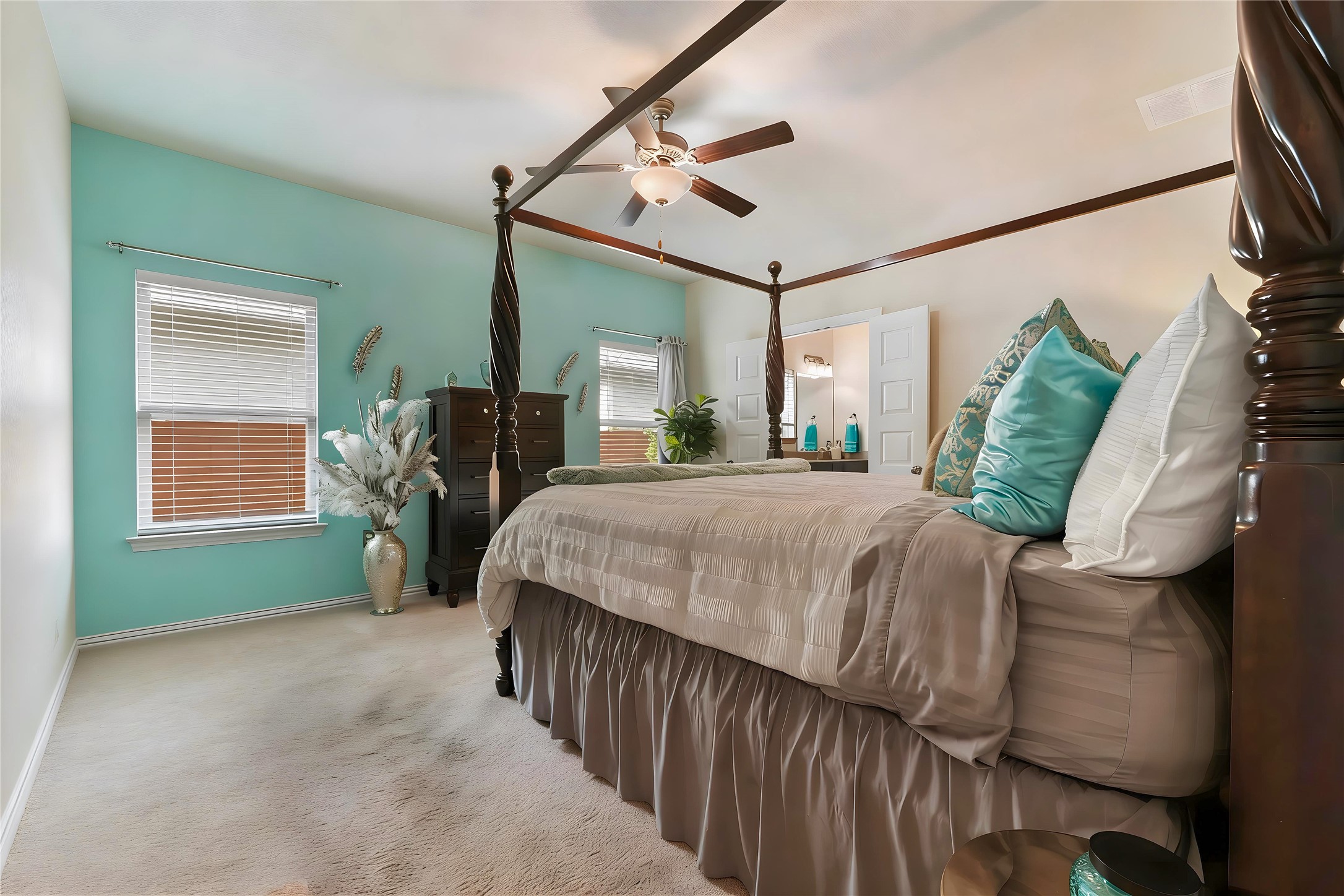 8721 Sikes Way Austin, TX 78747 - Photo 15 of 33 Primary bedroom featuring a ceiling fan, crown molding, and a tall vaulted ceiling
