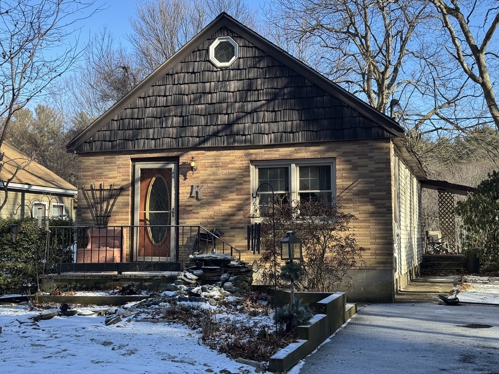 99 Leland Road Norfolk, MA 02056 - Photo 1 of 16 a front view of a house with parking area