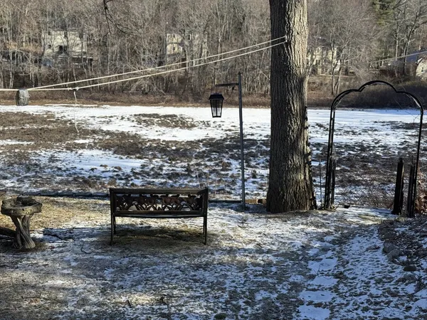 a view of a bench in the backyard