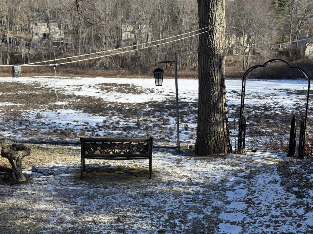 99 Leland Road Norfolk, MA 02056 - Photo 2 of 16 a view of a bench in the backyard