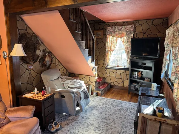a view of living room with furniture and a flat screen tv