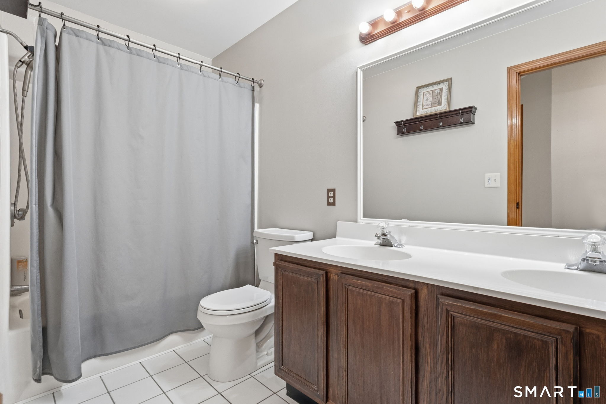 287 South Bear Hill Road Chaplin, CT 06235 - Photo 28 of 37 a bathroom with a sink a toilet and a mirror