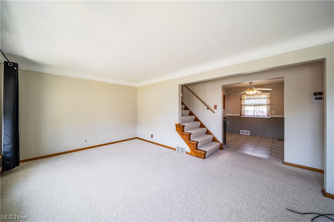 648 Pendley Road Willowick, OH 44095 - Photo 3 of 35 Carpeted living room with ornamental molding