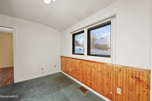 a view of an empty room with windows