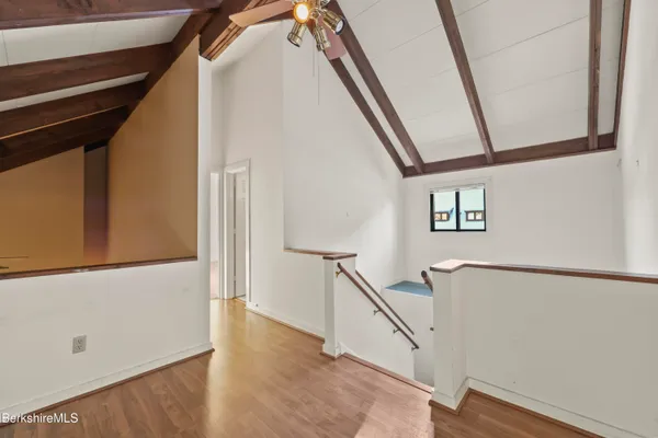 a view of an entryway with wooden floor
