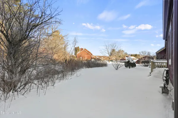 a view of a swimming pool and a lawn chairs
