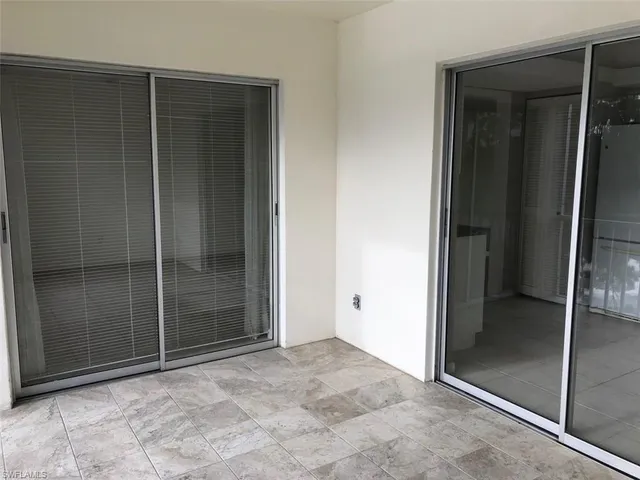 an empty room with sliding door