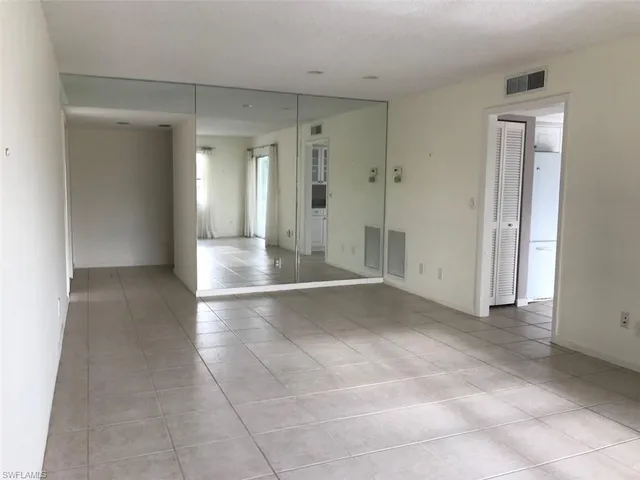 a view of a bathroom with a shower and a sink