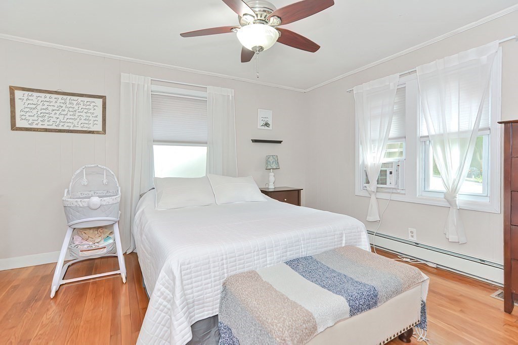 10 Rydal Street Worcester, MA 01602 - Photo 23 of 42 a bedroom with a bed and wooden floor