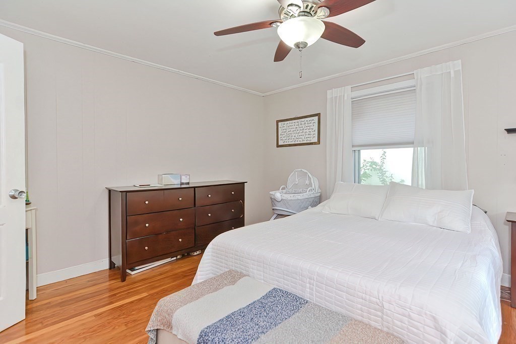 10 Rydal Street Worcester, MA 01602 - Photo 25 of 42 a bedroom with a bed and a chandelier