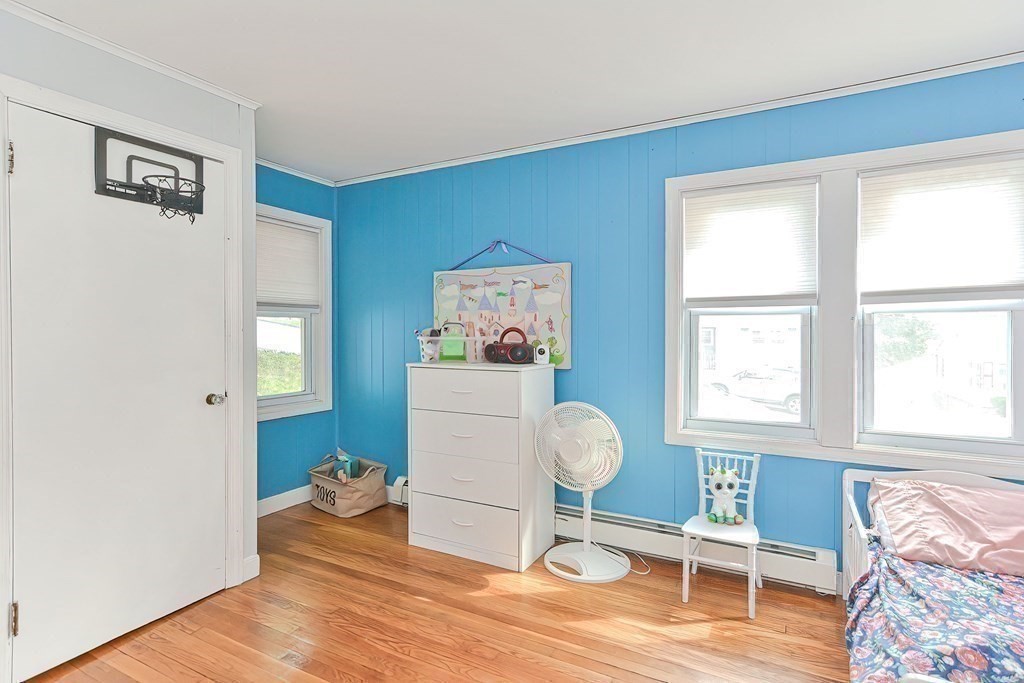 10 Rydal Street Worcester, MA 01602 - Photo 34 of 42 a living room with furniture a window and a lamp