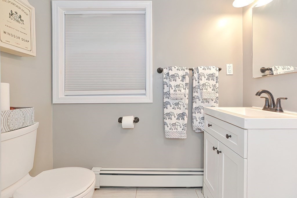 10 Rydal Street Worcester, MA 01602 - Photo 35 of 42 a bathroom with a sink mirror vanity and toilet