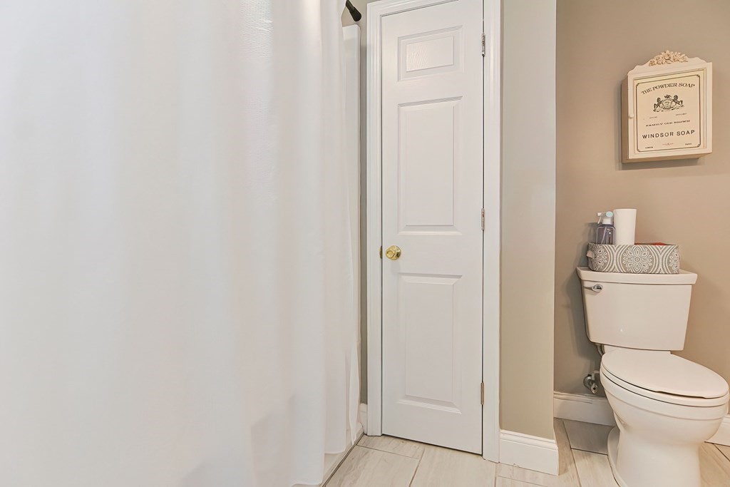 10 Rydal Street Worcester, MA 01602 - Photo 36 of 42 a white toilet sitting next to a white sink