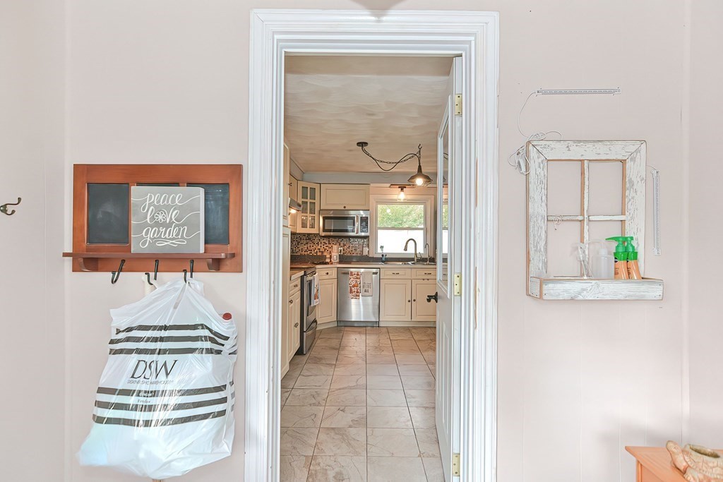 10 Rydal Street Worcester, MA 01602 - Photo 5 of 42 a view of a hallway with wooden floor and a living room