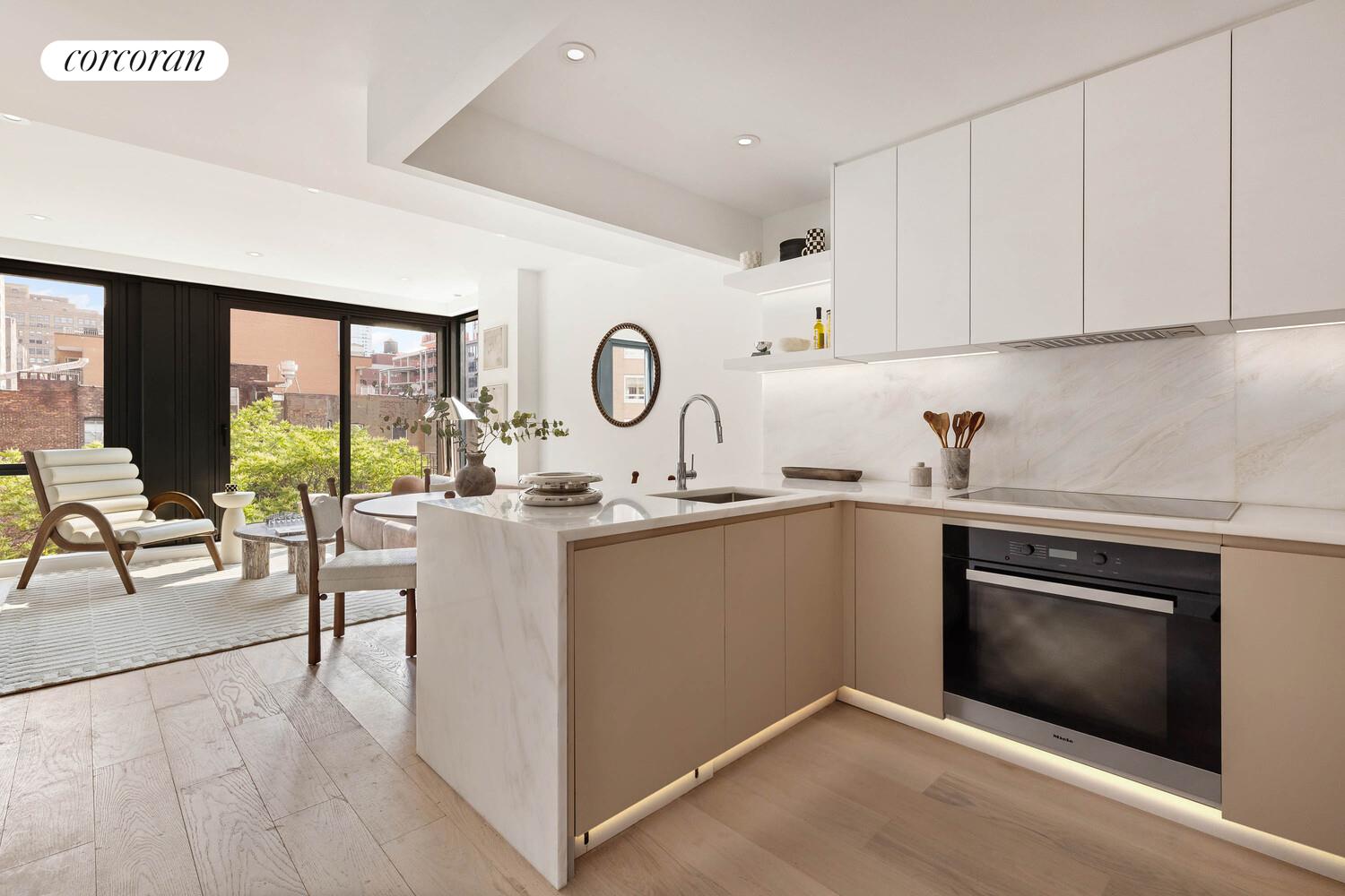 355 West 39th Street, Unit 6A Manhattan, NY 10018 - Photo 3 of 9 a kitchen with a sink cabinets and window