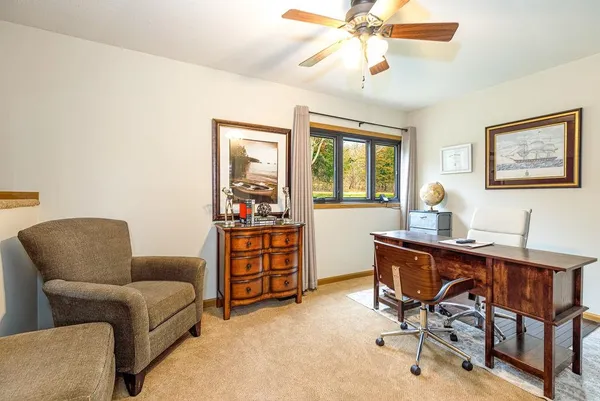 a living room with furniture and a window