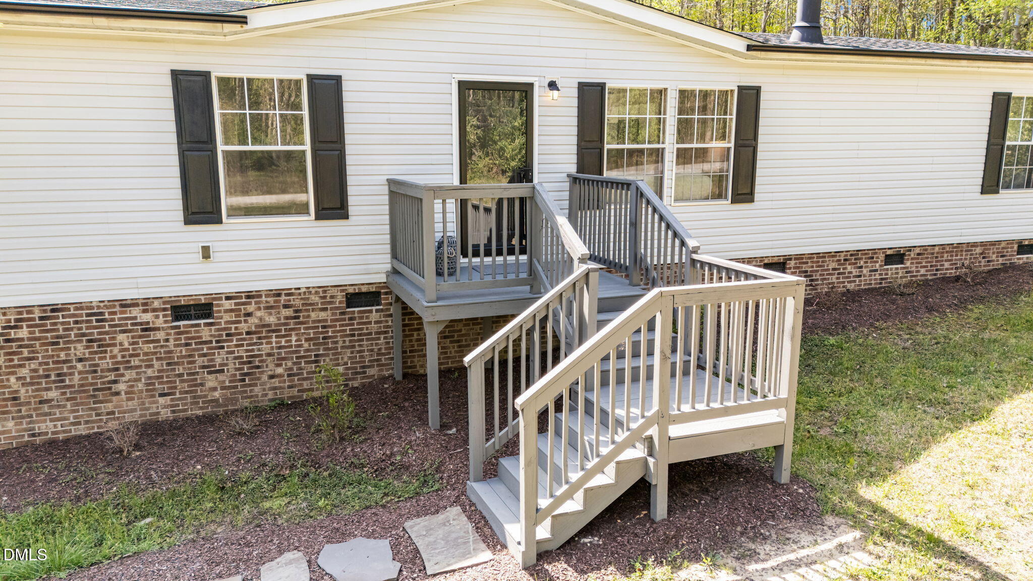 721 General Green Road Kittrell, NC 27544 - Photo 2 of 36 a front view of a house with two chairs and a table