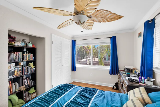 a bedroom with furniture and a book shelf