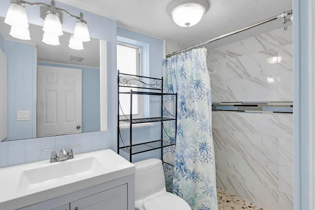 a view of a glass door with a tree