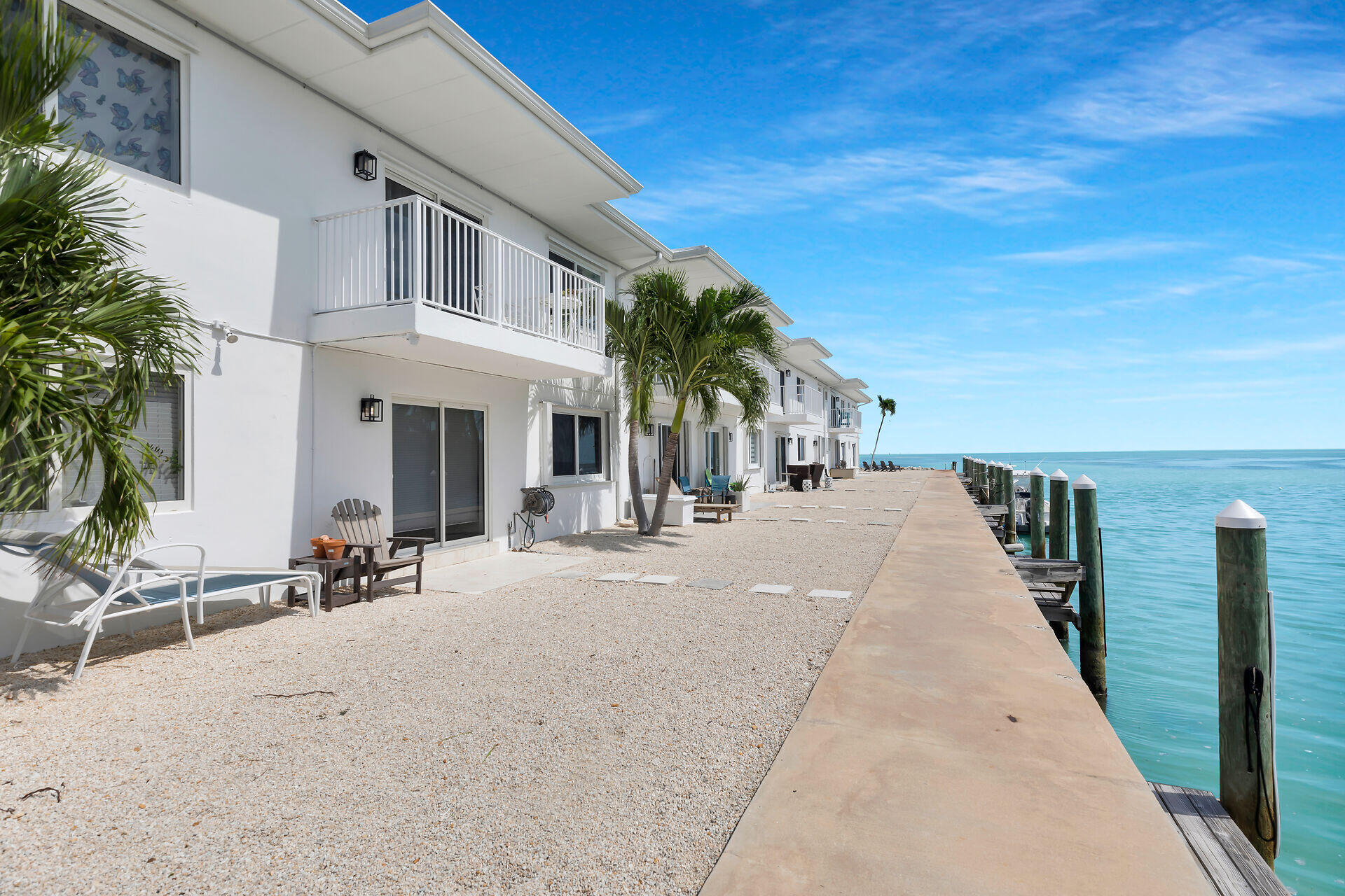1215 97th Street, Unit 6 Marathon, FL 33050 - Photo 16 of 20 a view of a building with a patio
