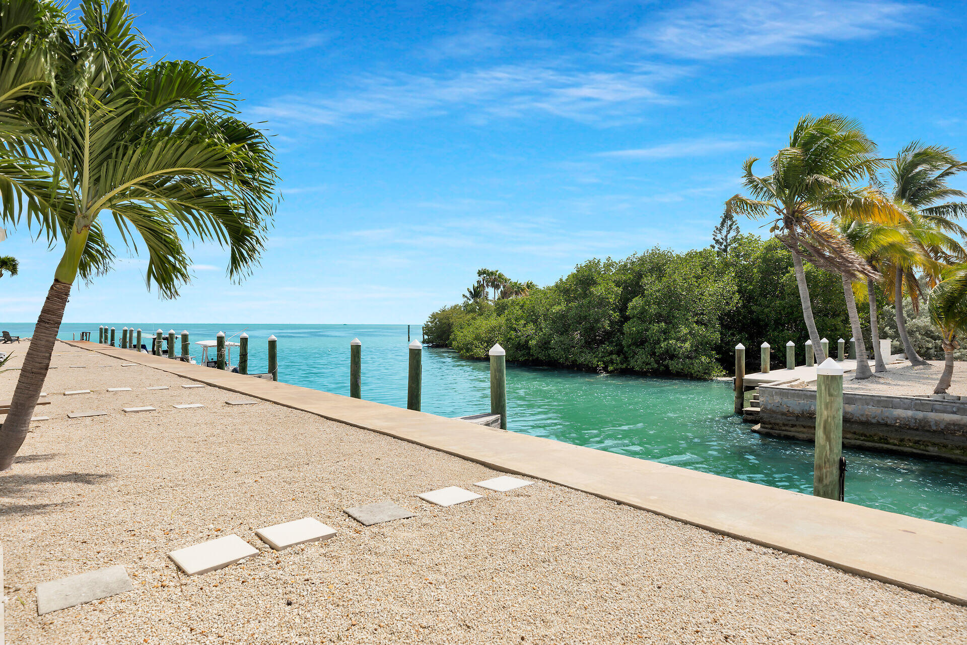 1215 97th Street, Unit 6 Marathon, FL 33050 - Photo 2 of 20 a view of a backyard