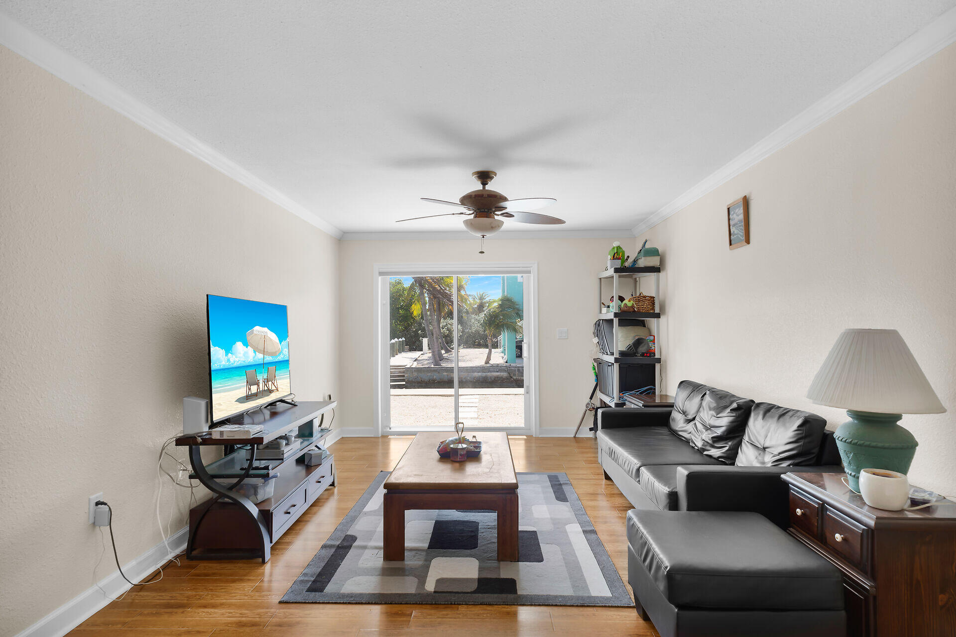1215 97th Street, Unit 6 Marathon, FL 33050 - Photo 7 of 20 a living room with furniture and a flat screen tv