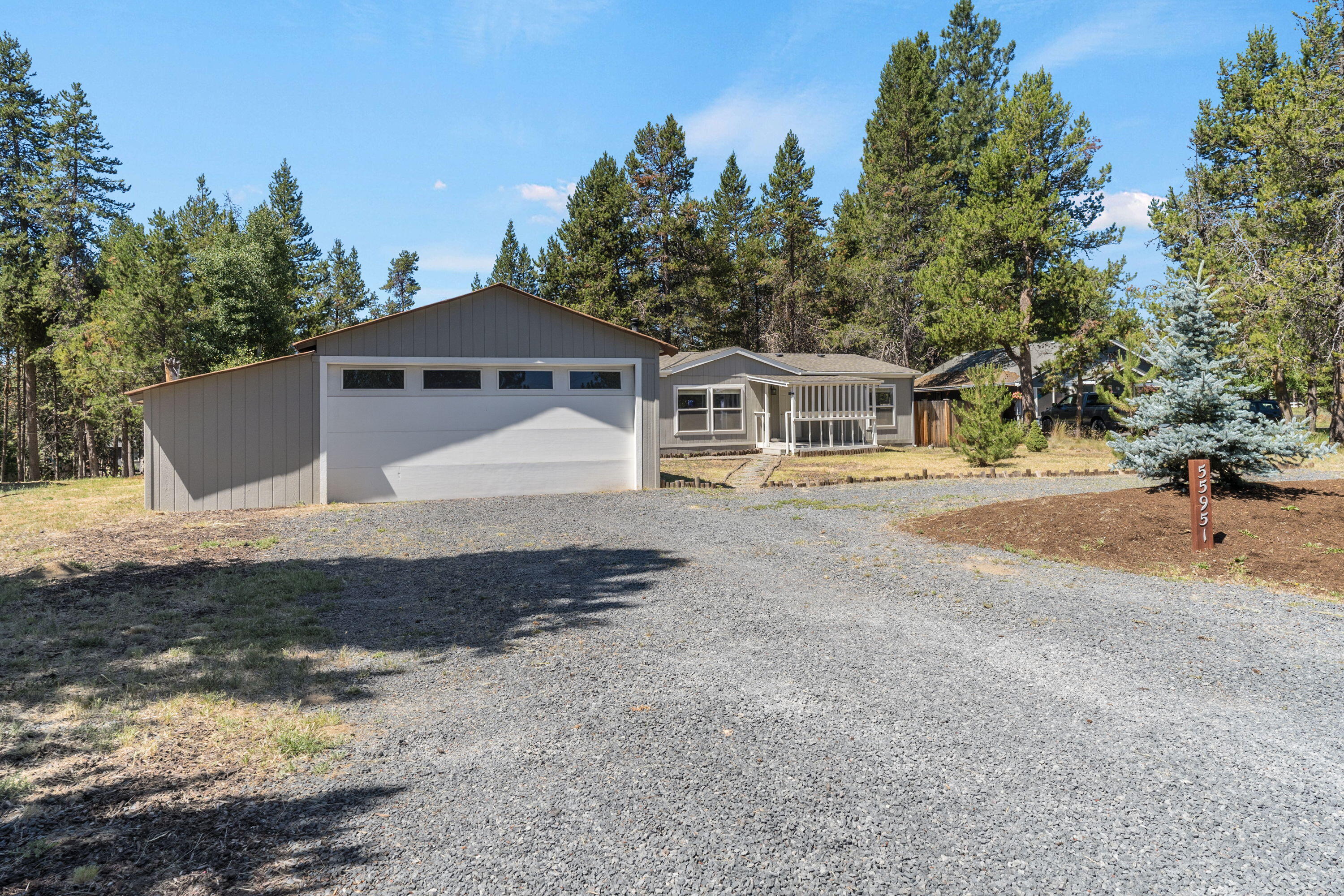 Includes two car garage with extra storage and RV parking space.