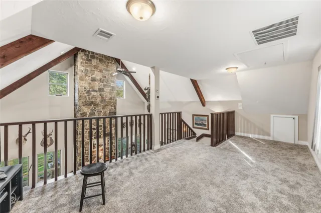 a view of an empty room with a table and chair