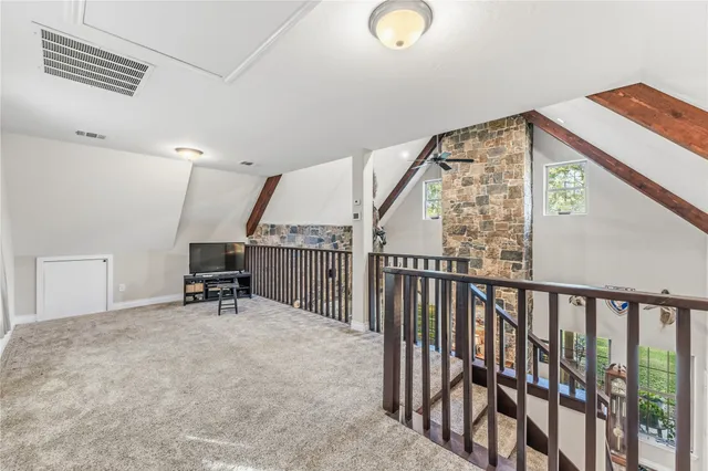 a view of a bedroom with wooden floor