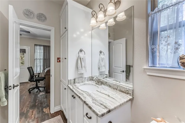 a view of a chairs and table in the balcony