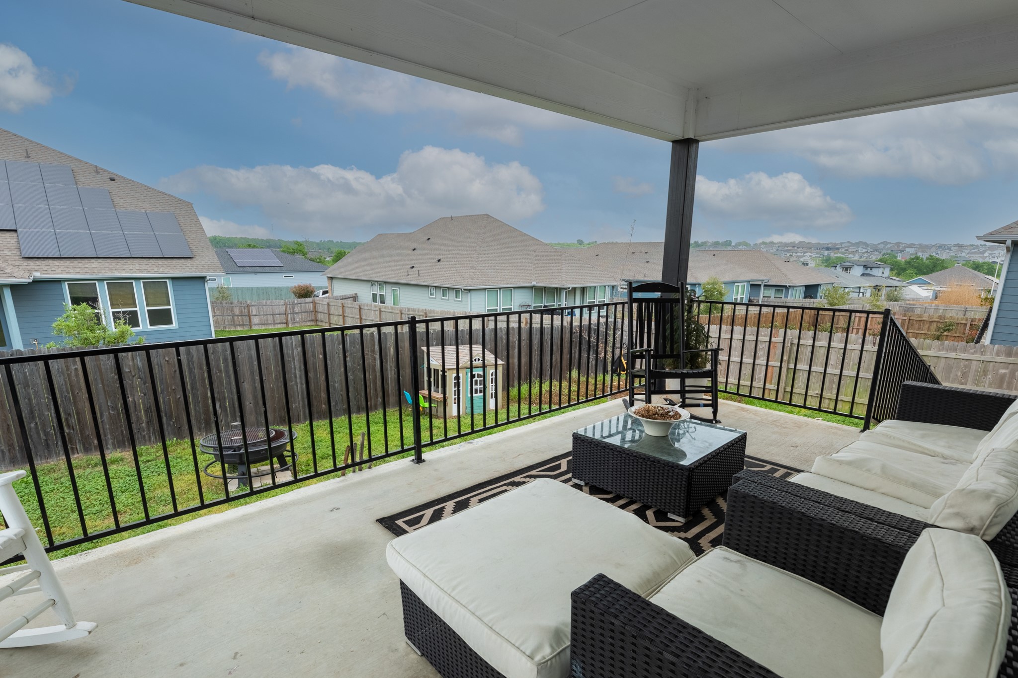 16512 Fetching Avenue Manor, TX 78653 - Photo 38 of 39 Balcony with a patio area, a residential view, and an outdoor hangout area