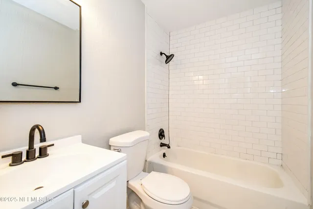 a bathroom with a toilet sink and a bathtub