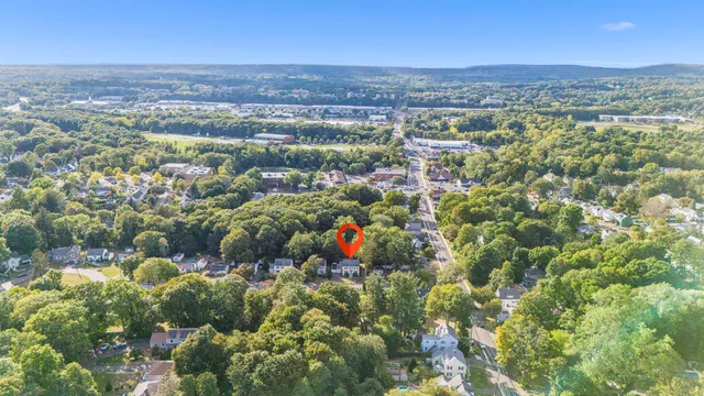 a living room with furniture a rug and a flat screen tv