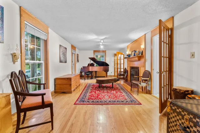 a view of a livingroom with furniture and a window