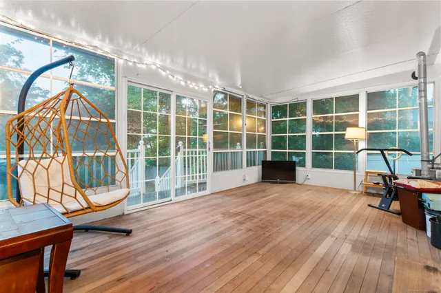 a kitchen that has a lot of cabinets in it and wooden cabinets