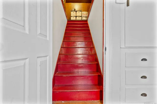 a living room with lots of stuff and a flat screen tv