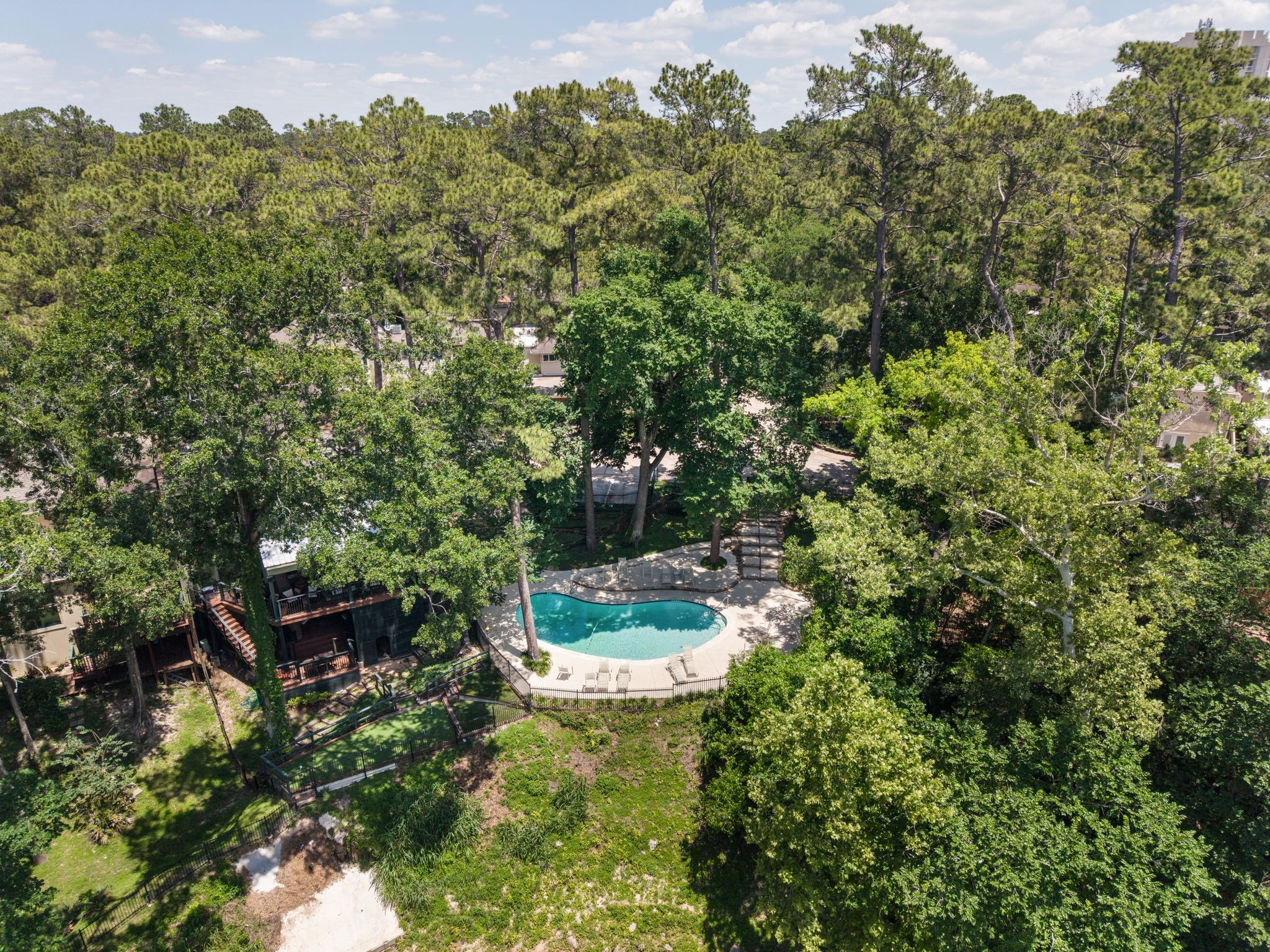 201 Vanderpool Lane, Unit 137 Houston, TX 77024 - Photo 37 of 42 Additional community amenities include a sparkling community pool, tennis and basketball court — offering the perfect mix of recreation, relaxation, and an active lifestyle right within the neighborhood.