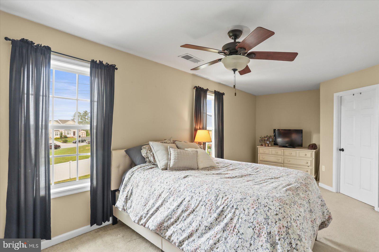 14 Galaxy Drive Hanover, PA 17331 - Photo 16 of 38 a bedroom with a bed and a chandelier