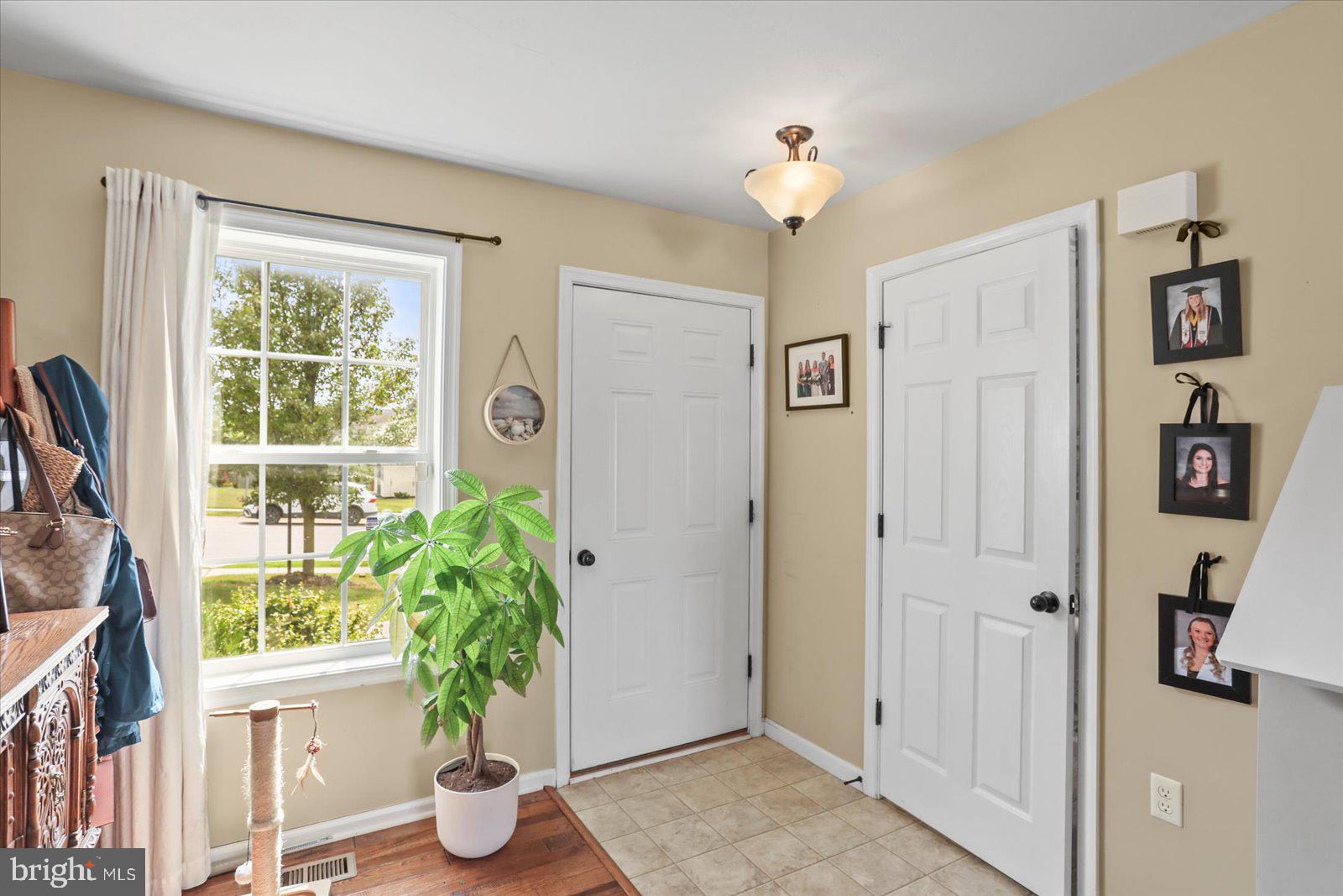 14 Galaxy Drive Hanover, PA 17331 - Photo 2 of 38 a living room with furniture and a potted plant