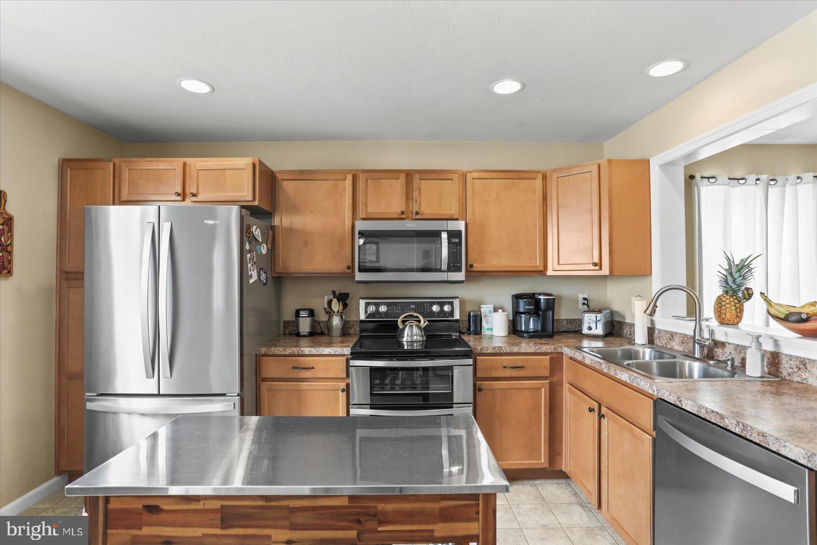 14 Galaxy Drive Hanover, PA 17331 - Photo 5 of 38 a kitchen with granite countertop a refrigerator stove and sink