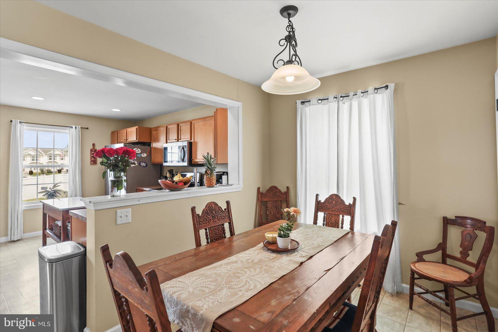 14 Galaxy Drive Hanover, PA 17331 - Photo 9 of 38 a dining room filled chandelier and wooden floor