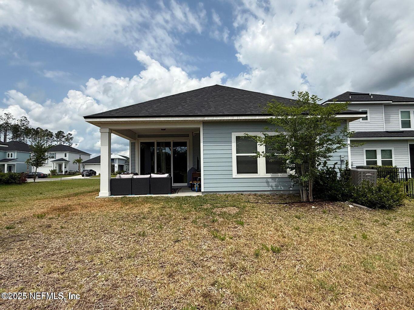 195 Torres Street St. Augustine, FL 32095 - Photo 20 of 22 front view of house with a yard