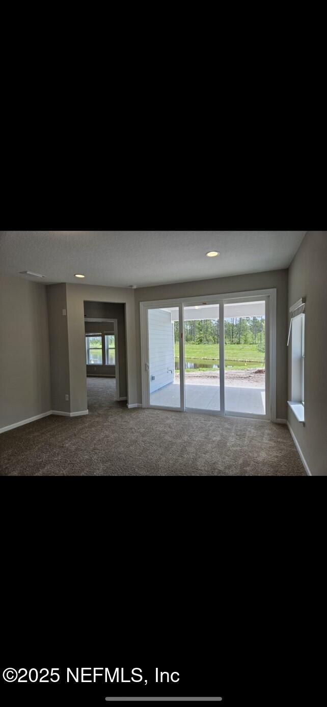 195 Torres Street St. Augustine, FL 32095 - Photo 10 of 22 a view of two room with wooden floor and outdoor space