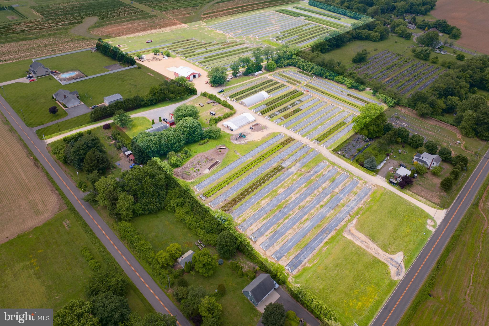 an aerial view of a house a yard and outdoor seating